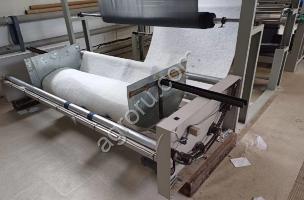 Машина для размотки ткани и наполнителя