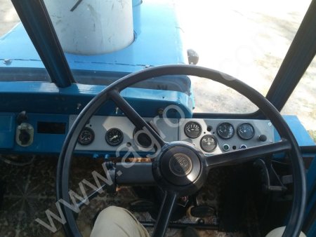 трактор Т-150К со снегоуборочным отвалом и противовесом