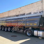 Полуприцеп самосвал четырехосный гибрид с задним свалом